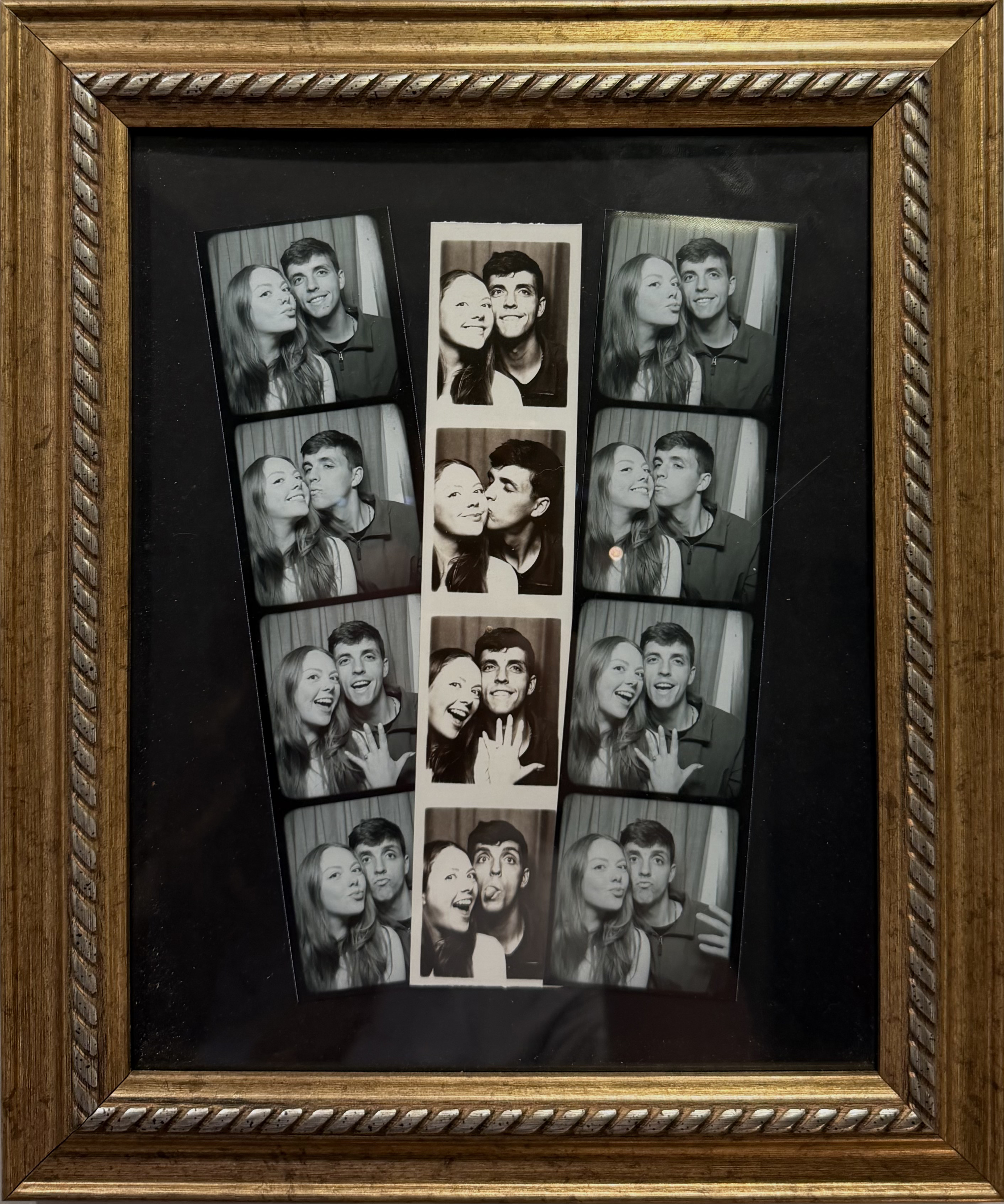 Polaroid photo of a couple posing together on a bed with the date 06/10/19 written on the polaroid.